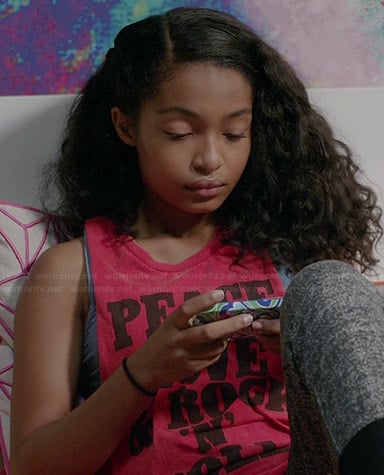 Zoey’s red “Peace Love & Rock n Roll” tank top on Black-ish