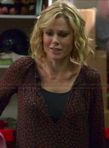 Claire’s red and navy printed blouse on Modern Family