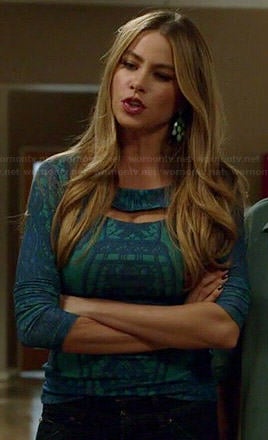 Gloria's green and blue lace cutout top on Modern Family
