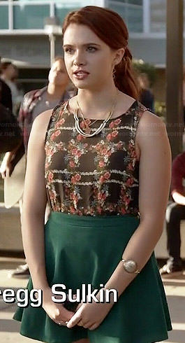 Karma’s black floral top and green circle skirt on Faking It