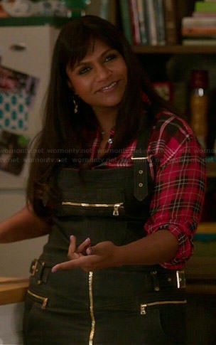 Mindy's red plaid shirt and black denim overall dress on The Mindy Project