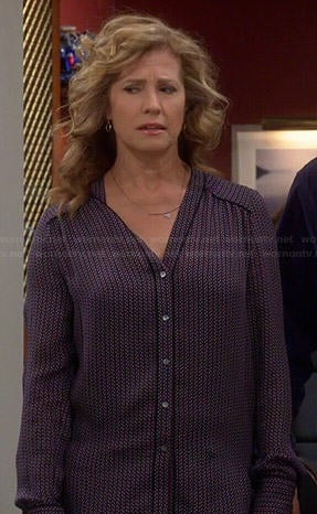 Vanessa’s geometric printed v-neck blouse on Last Man Standing