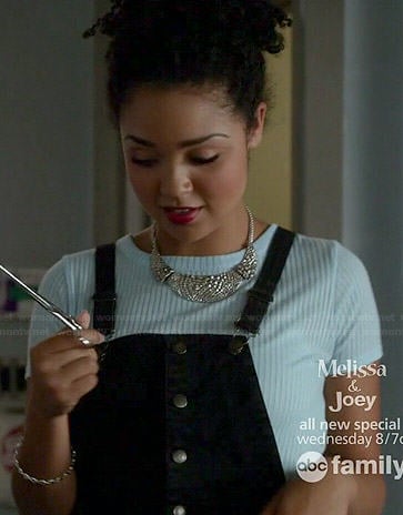 Beth's blue crop top and black button front overalls on Chasing Life