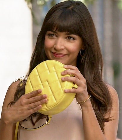 Cece's cream tank top and round yellow bag on New Girl