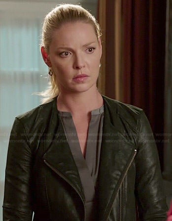 Charlie's grey split neck blouse and leather jacket on State of Affairs