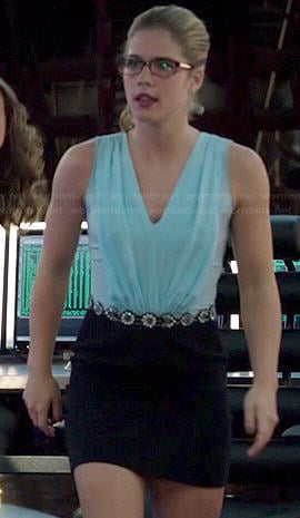 Felicity's light blue pleated v-neck dress with black skirt on Arrow