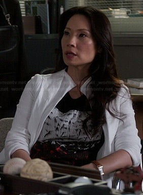 Joan's black, white and red abstract graphic top on Elementary