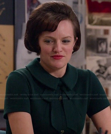 Peggy's green button front dress with tie neck on Mad Men