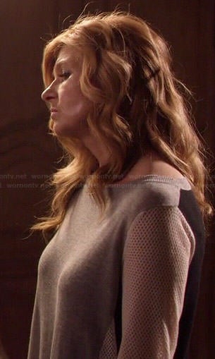 Rayna’s grey colorblock sweater with mesh sleeves on Nashville