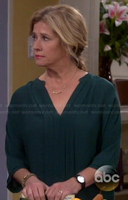 Vanessa's green pleated front blouse on Last Man Standing