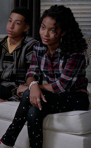 Zoey’s plaid shirt and black paint splatter jeans on Black-ish