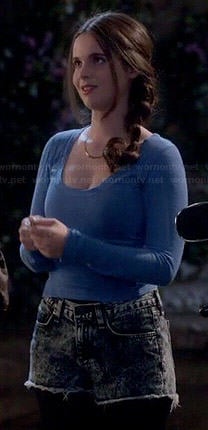 Bay's blue long sleeved top and acid wash denim shorts on Switched at Birth