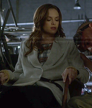 Caitlin's plaid top and grey coat on The Flash