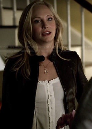 Caroline’s white ruffled trim top and leather jacket on The Vampire Diaries