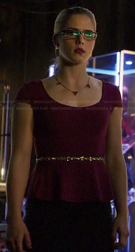 Felicity’s purple peplum top and gold skinny belt on Arrow