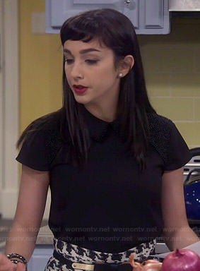 Mandy’s black beaded collar top and houndstooth skirt on Last Man Standing