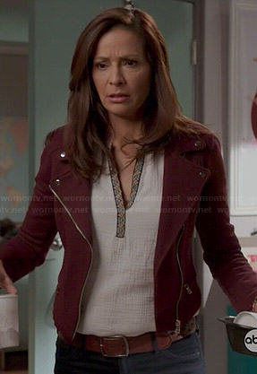 Regina’s white split neck top and burgundy moto jacket on Switched at Birth