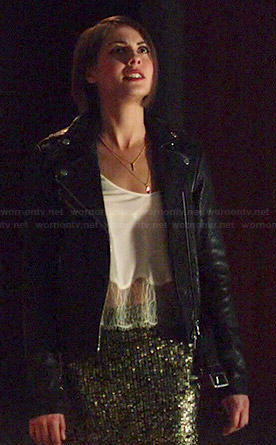 Thea’s white lace hem cami, gold sequin skirt and leather jacket on Arrow