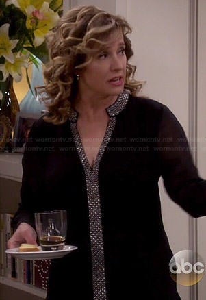 Vanessa’s black blouse with printed trim on Last Man Standing