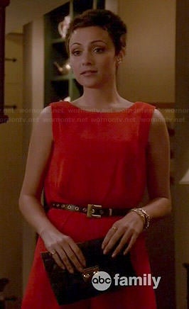 April's red open back romper on Chasing Life