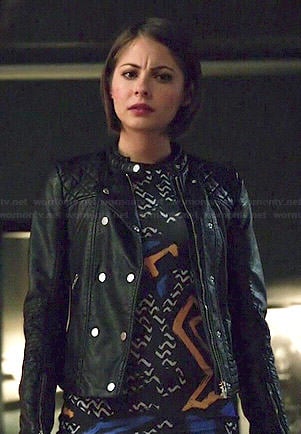 Thea’s graffiti printed dress and leather jacket on Arrow