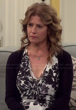 Vanessa’s black and white floral print v-neck top on Last Man Standing