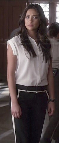 Emily’s white sleeveless shirt and black and white trousers on Pretty Little Liars