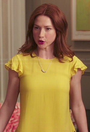 Kimmy's yellow top with lace trimmed sleeves on Unbreakable Kimmy Schmidt