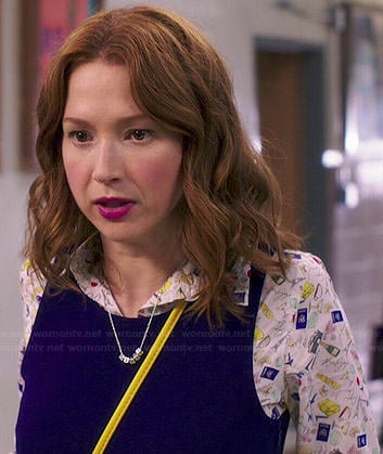 Kimmy's French printed shirt and navy dress on Unbreakable Kimmy Schmidt