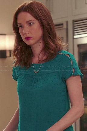 Kimmy's teal green button shoulder top on Unbreakable Kimmy Schmidt