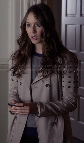 Spencer’s studded trench coat and colorblock sweater on Pretty Little Liars
