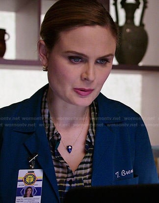 Brennan’s plaid blouse and blue triangle necklace on Bones