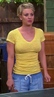 Penny's yellow v-neck tee and blue shorts on The Big Bang Theory