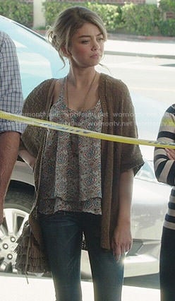 Haley's printed top and brown cardigan on Modern Family