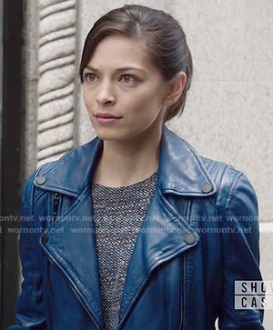 Cat's blue leather moto jacket and layered top on Beauty and the Beast