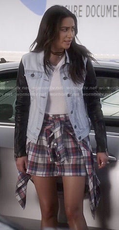Emily's plaid shorts and denim jacket with leather sleeves on Pretty Little Liars