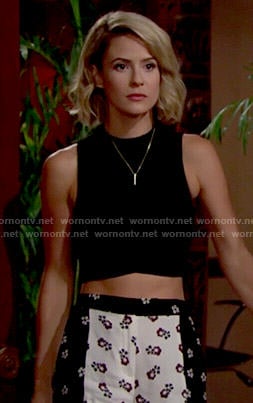 Caroline's floral shorts and black crop top on The Young and the Restless