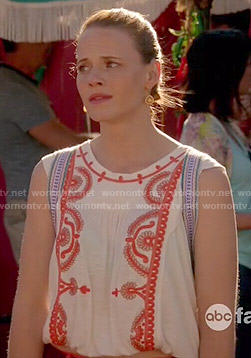 Daphne's white top with red embroidery on Switched at Birth