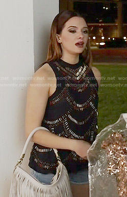Karma’s beaded top and white fringed bag on Faking It
