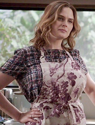 Brennan's checked top and grape print apron on Bones