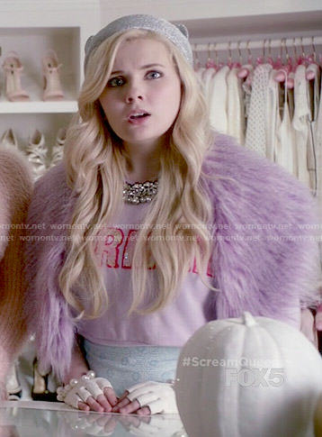 Chanel 5’s purple mermaid sweater and cap with ears on Scream Queens
