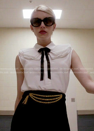 Chanel’s white ruffled collar shirt and black chain detail skirt on Scream Queens