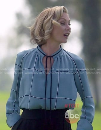 Elizabeth’s blue checked tie-neck blouse on Scandal