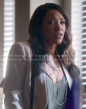 Iris's white cropped jacket and green cami on The Flash