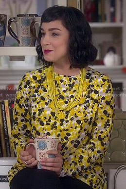 Mandy’s yellow printed blouse on Last Man Standing