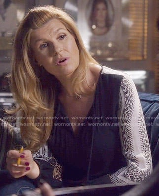 Rayna's black blouse with printed sleeves on Nashville