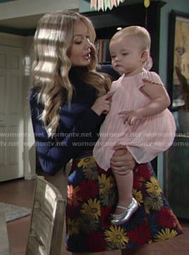 Abby’s floral skirt and navy blue turtleneck on The Young and the Restless