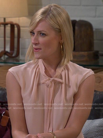 Caroline’s blush tie-neck blouse on 2 Broke Girls