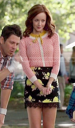 Cassandra's black and yellow floral skirt and coral printed cardigan on The Librarians