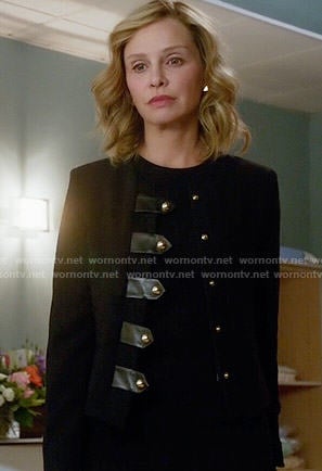 Cat’s black jacket with leather tabs on Supergirl